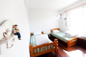 Łóżko lub łóżka w pokoju w obiekcie Alice Springs Homestay