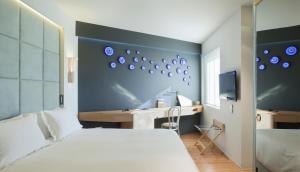 Postel nebo postele na pokoji v ubytování New Hotel