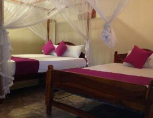 מיטה או מיטות בחדר ב-Jaya Home Stay