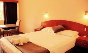 Postel nebo postele na pokoji v ubytování Childers Gateway Motor Inn