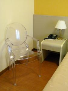 Postel nebo postele na pokoji v ubytování Hotel Centrale Byron