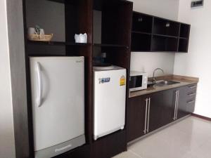 Kuchyň nebo kuchyňský kout v ubytování The Park 304 Executive Serviced Apartment