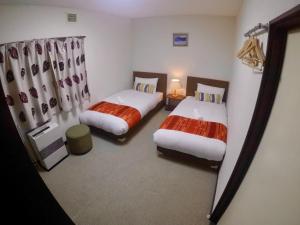 Letto o letti in una camera di Mojo Lodge Hakuba