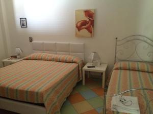 Letto o letti in una camera di Borgo Console