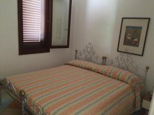 Letto o letti in una camera di Borgo Console