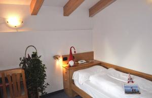 Postel nebo postele na pokoji v ubytování Albergo Antico