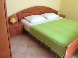 Postel nebo postele na pokoji v ubytování Apartmani Marica