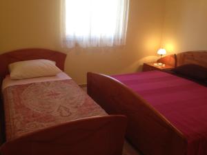 Postel nebo postele na pokoji v ubytování Apartmani Marica