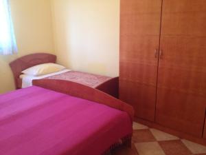 Postel nebo postele na pokoji v ubytování Apartmani Marica