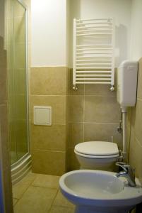 a bathroom with a toilet and a sink at Anna 2 bedrooms 2 bathrooms 6 bikes in Budapest
