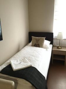Letto o letti in una camera di Cafe-Restaurant LEO