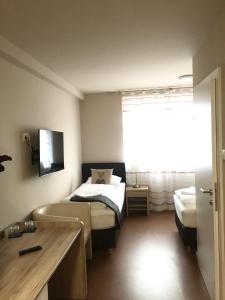 Letto o letti in una camera di Cafe-Restaurant LEO