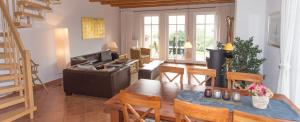 a living room with a couch and a table at Landhaus am Goor in Putbus
