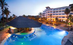 a hotel with a large swimming pool with a large building at SH Villa Gadea in Altea