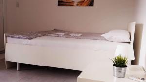 Postel nebo postele na pokoji v ubytování IN Villa Guesthouse