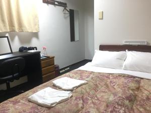 Postel nebo postele na pokoji v ubytování Hotel Todai