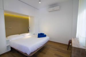 En eller flere senge i et værelse på HACIENDA 10B MENYBER