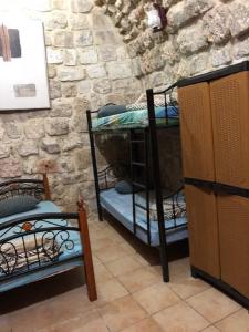 Ένα ή περισσότερα κρεβάτια σε δωμάτιο στο Bab El-Silsileh Hostel