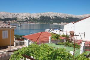 a view of a body of water from a house at Apartment Mario with Terrace and Sea View in Baška