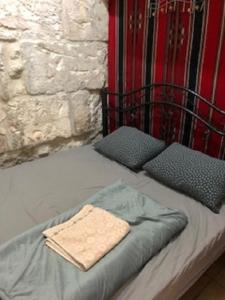 Ένα ή περισσότερα κρεβάτια σε δωμάτιο στο Bab El-Silsileh Hostel
