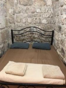 Ένα ή περισσότερα κρεβάτια σε δωμάτιο στο Bab El-Silsileh Hostel