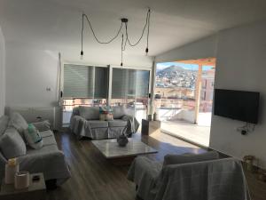 Televízia a/alebo spoločenská miestnosť v ubytovaní Vita Mediterranea - Saranda Design Apartment