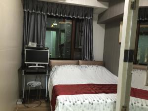 Postel nebo postele na pokoji v ubytování Hong Kong Tai San Guest House (Burlington Branch)
