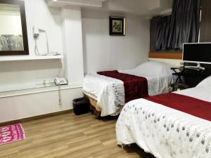 Postel nebo postele na pokoji v ubytování Hong Kong Tai San Guest House (Burlington Branch)