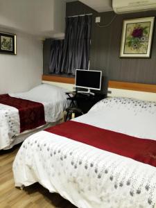 Postel nebo postele na pokoji v ubytování Hong Kong Tai San Guest House (Burlington Branch)