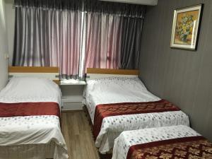 Postel nebo postele na pokoji v ubytování Hong Kong Tai San Guest House (Burlington Branch)