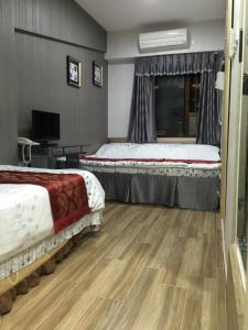 Postel nebo postele na pokoji v ubytování Hong Kong Tai San Guest House (Burlington Branch)