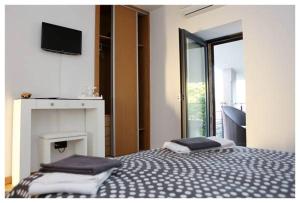 a bedroom with a bed with two pillows on it at Casa do Parada in Messegães