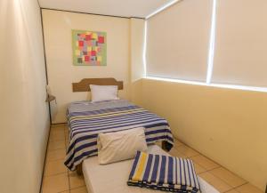 Postel nebo postele na pokoji v ubytování Hotel Mateos 1215