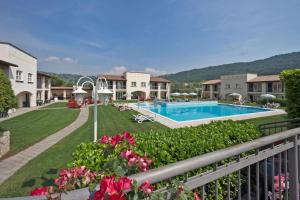 a view of a resort with a swimming pool at Residence Corte Delle Rose in Garda