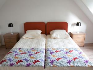 Cama ou camas em um quarto em Cornelly Vakantiewoningen