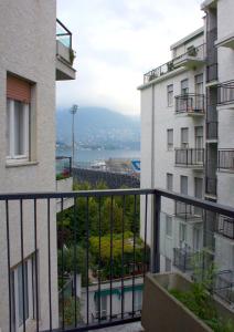 a view from the balcony of a apartment building at Hotel Engadina in Como