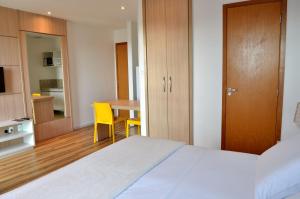 Postel nebo postele na pokoji v ubytování Unico Apart Hotel