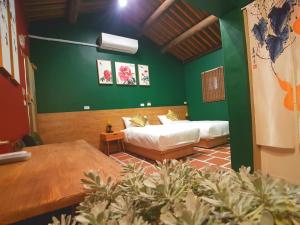Postel nebo postele na pokoji v ubytování Zhu Shan Homestay