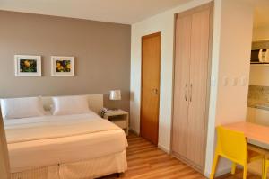 Postel nebo postele na pokoji v ubytování Unico Apart Hotel