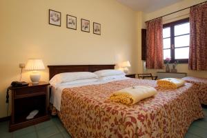 Postel nebo postele na pokoji v ubytování Hotel Molino D'Era