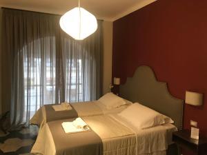 Ein Bett oder Betten in einem Zimmer der Unterkunft Residenza Roma Imperiale