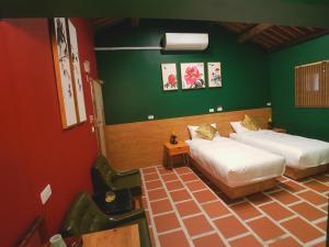 Postel nebo postele na pokoji v ubytování Zhu Shan Homestay