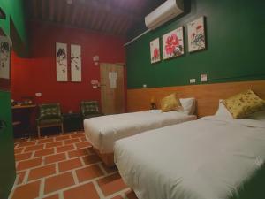 Postel nebo postele na pokoji v ubytování Zhu Shan Homestay