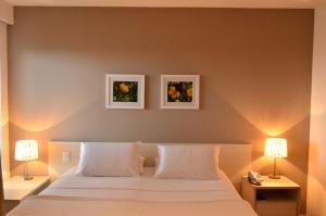Postel nebo postele na pokoji v ubytování Unico Apart Hotel