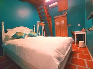 Postel nebo postele na pokoji v ubytování Zhu Shan Homestay