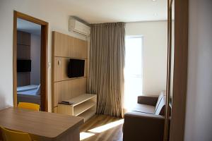 TV a/nebo společenská místnost v ubytování Unico Apart Hotel