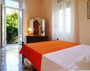 a bedroom with a bed and a large window at Italian flair with a view in Rhodes Town