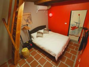 Postel nebo postele na pokoji v ubytování Zhu Shan Homestay
