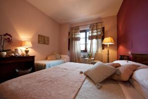 Postel nebo postele na pokoji v ubytování Hotel Molino D'Era