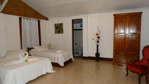 Postel nebo postele na pokoji v ubytování Atobá Villas